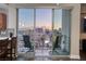 Balcony with city views and seating for two at 150 Las Vegas Blvd # 907, Las Vegas, NV 89101