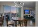 Bright dining area with city views and modern chandelier at 150 Las Vegas Blvd # 907, Las Vegas, NV 89101