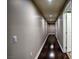 Long hallway with dark hardwood floors and recessed lighting at 150 Las Vegas Blvd # 907, Las Vegas, NV 89101