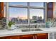 Modern kitchen sink with city views from the window at 150 Las Vegas Blvd # 907, Las Vegas, NV 89101