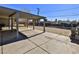 Covered patio, expansive backyard, and view of fence at 1605 Oakwood Ave, North Las Vegas, NV 89030