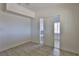 Bright bedroom with tile floors and built-in shelving at 1605 Oakwood Ave, North Las Vegas, NV 89030