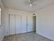 Bright bedroom with tile floors and double closets at 1605 Oakwood Ave, North Las Vegas, NV 89030