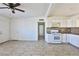 Bright kitchen with white cabinets and tile floor at 1605 Oakwood Ave, North Las Vegas, NV 89030