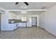 Bright kitchen with white cabinets and tile floor at 1605 Oakwood Ave, North Las Vegas, NV 89030