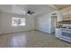 Spacious living room with tile flooring and ceiling fan at 1605 Oakwood Ave, North Las Vegas, NV 89030