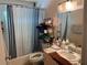 Bathroom with shower/tub combo and updated vanity at 2180 Palora Ave, Las Vegas, NV 89169