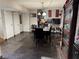 Dining area with a large table and dark flooring at 2180 Palora Ave, Las Vegas, NV 89169