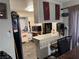 Kitchen with breakfast bar and partial view of the living area at 2180 Palora Ave, Las Vegas, NV 89169