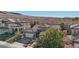 Aerial view of a house with tile roof and desert landscape at 2261 Boutique Ave, Henderson, NV 89044