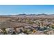 Aerial view of a luxury community with mountain views and solar panels at 2261 Boutique Ave, Henderson, NV 89044