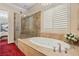 Spa-like bathroom with soaking tub and glass shower at 2261 Boutique Ave, Henderson, NV 89044