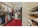 Large walk-in closet with ample shelving and hanging space at 2261 Boutique Ave, Henderson, NV 89044