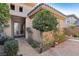 Front entrance with double doors and decorative landscaping at 2261 Boutique Ave, Henderson, NV 89044