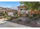 House exterior with stone facade and well-maintained landscaping at 2261 Boutique Ave, Henderson, NV 89044