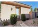 Private backyard access with a stone patio and lush landscaping at 2261 Boutique Ave, Henderson, NV 89044