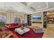 Living room featuring a modern fireplace and built-in shelving at 2261 Boutique Ave, Henderson, NV 89044