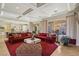 Spacious living room with red sofa and modern fireplace at 2261 Boutique Ave, Henderson, NV 89044