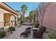 Private backyard patio with seating and stone accents at 2261 Boutique Ave, Henderson, NV 89044