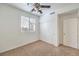 Well-lit bedroom with ceiling fan and closet at 2374 Thayer Ave, Henderson, NV 89074