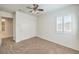 Spacious bedroom featuring carpet floors, a double-door closet, and a ceiling fan at 2374 Thayer Ave, Henderson, NV 89074