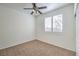 Spacious bedroom with ceiling fan and window at 2374 Thayer Ave, Henderson, NV 89074