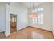 Bright dining room with hardwood floors and kitchen access at 2374 Thayer Ave, Henderson, NV 89074