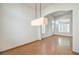 Dining room with hardwood floors and a modern light fixture at 2374 Thayer Ave, Henderson, NV 89074