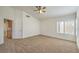 Spacious main bedroom with high ceilings, ceiling fan and access to hallway at 2374 Thayer Ave, Henderson, NV 89074