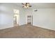 Large main bedroom with high ceilings, ceiling fan, and carpet flooring at 2374 Thayer Ave, Henderson, NV 89074