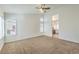 Main bedroom with high ceilings, ceiling fan, and access to en-suite bathroom at 2374 Thayer Ave, Henderson, NV 89074