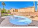 Relaxing kidney-shaped pool with surrounding landscaping at 2374 Thayer Ave, Henderson, NV 89074