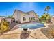 Inviting kidney-shaped pool with surrounding landscaping at 2374 Thayer Ave, Henderson, NV 89074