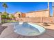 Relaxing kidney-shaped pool with surrounding landscaping at 2374 Thayer Ave, Henderson, NV 89074