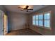 Bright bedroom with ceiling fan and large window with plantation shutters at 2575 Red Planet St, Henderson, NV 89044