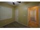 Bedroom with ceiling fan, window shutters, and access to another room at 2575 Red Planet St, Henderson, NV 89044