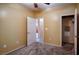 Bedroom with ceiling fan, closet, and view of kitchen at 2575 Red Planet St, Henderson, NV 89044