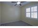 Well-lit bedroom with ceiling fan and plantation shutters at 2575 Red Planet St, Henderson, NV 89044