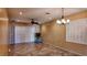 Spacious dining area with tile floors, ceiling fan, and large windows at 2575 Red Planet St, Henderson, NV 89044