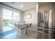 Kitchen dining area with table and chairs, sliding door to patio at 264 Bella Matese Ave, Las Vegas, NV 89183