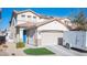 Two-story house with beige exterior and a two-car garage at 264 Bella Matese Ave, Las Vegas, NV 89183