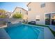 Modern pool with water feature and ample space for lounging at 264 Bella Matese Ave, Las Vegas, NV 89183