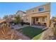 Artificial turf backyard with a covered patio area at 266 Cullerton St, Las Vegas, NV 89148