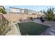 Landscaped backyard featuring artificial turf and patio at 266 Cullerton St, Las Vegas, NV 89148