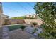 Landscaped backyard with artificial turf and string lights at 266 Cullerton St, Las Vegas, NV 89148