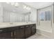 Elegant bathroom with double vanity, soaking tub, and shower at 266 Cullerton St, Las Vegas, NV 89148