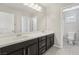 Modern bathroom with double vanity and a separate toilet area at 266 Cullerton St, Las Vegas, NV 89148