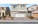 Two-story home with attached garage and landscaped yard at 266 Cullerton St, Las Vegas, NV 89148