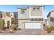 Tan two-story house with a two-car garage and landscaped front yard at 266 Cullerton St, Las Vegas, NV 89148