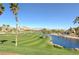 Golf course with a lake and mountain views at 266 Cullerton St, Las Vegas, NV 89148